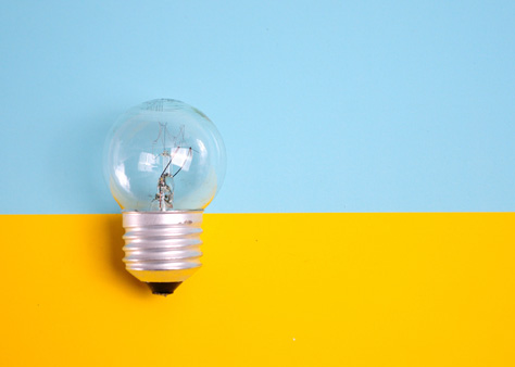 A lightbulb with a blue and yellow background